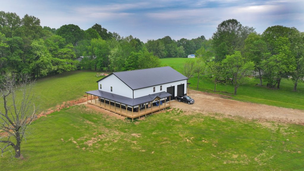 Aerial view of a metal wrapped house in the country