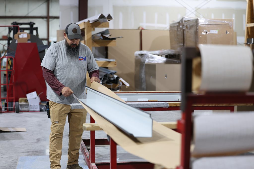 Metal trim is carefully wrapped to prevent damage