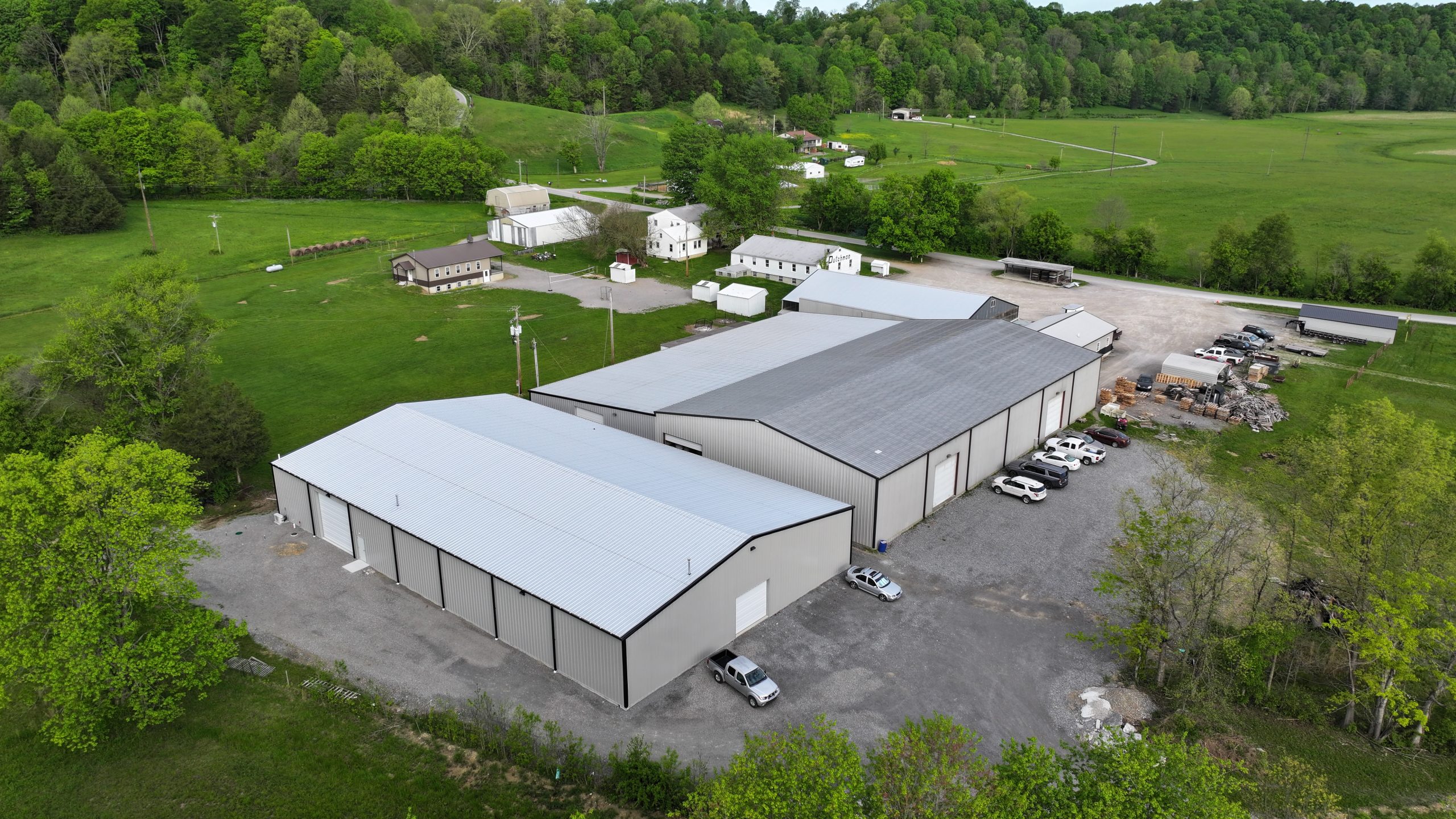 Dutchman Metal facility with lush green surroundings