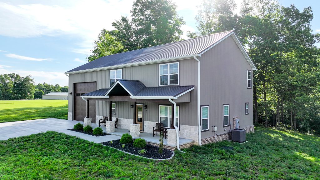 New home with metal siding, roof, and trim