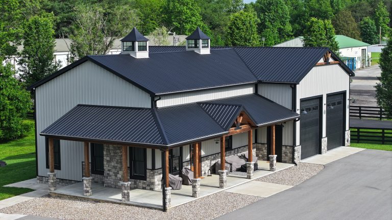 Beautiful home with metal roof and siding, large garage, and wooden porch beams