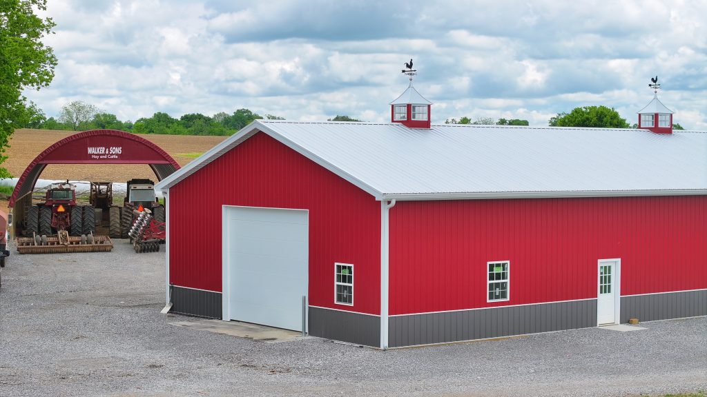 Brightly colored machinery shop on a farm.