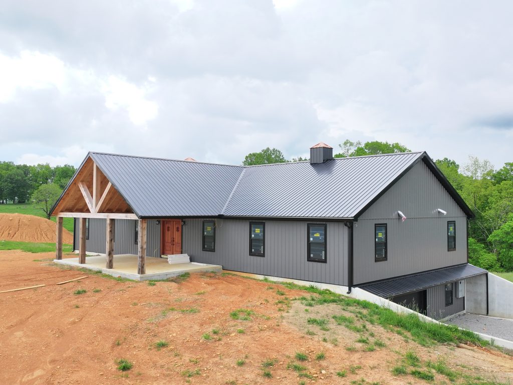 Dark grey and black metal used for the roof and walls of a new house