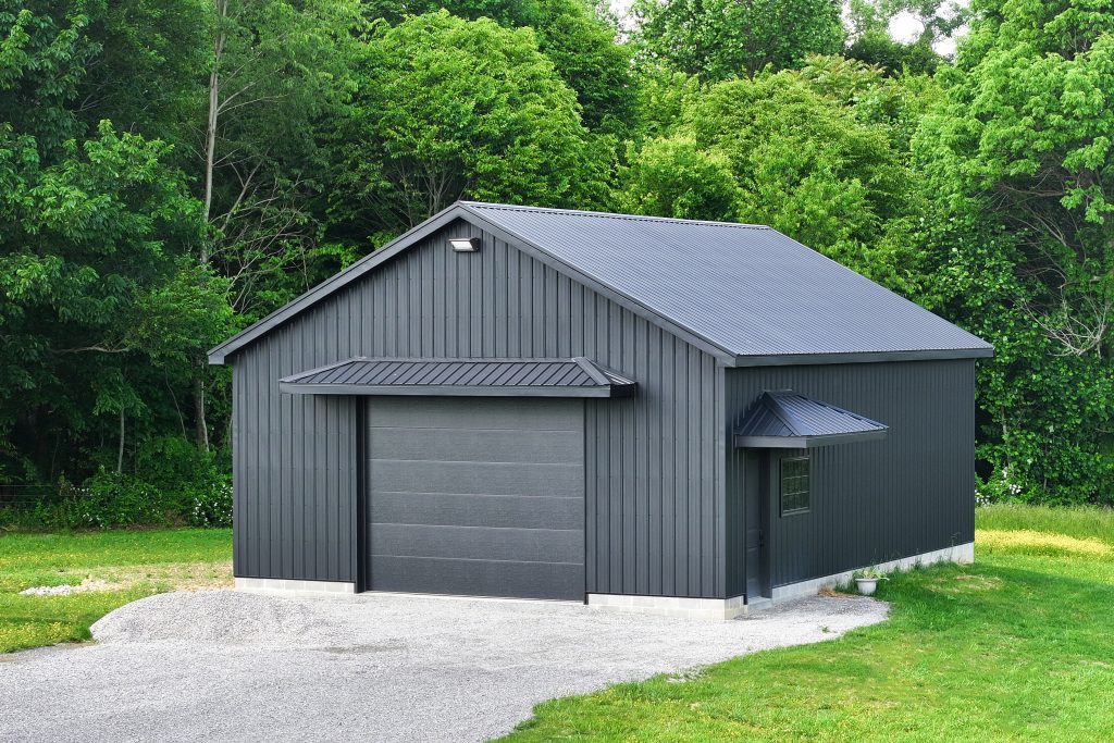Black roof and siding on a quaint garage