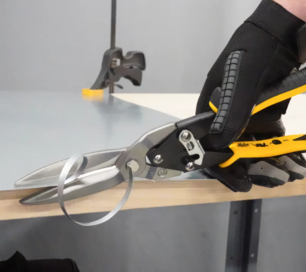 Malco Tools metal snips cuts through metal